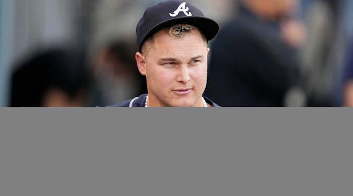 Oct 21, 2021; Los Angeles, California, USA; Atlanta Braves right fielder Joc Pederson (22) wears pearls in the dugout before game five of the 2021 NLCS against the Los Angeles Dodgers at Dodger Stadium.